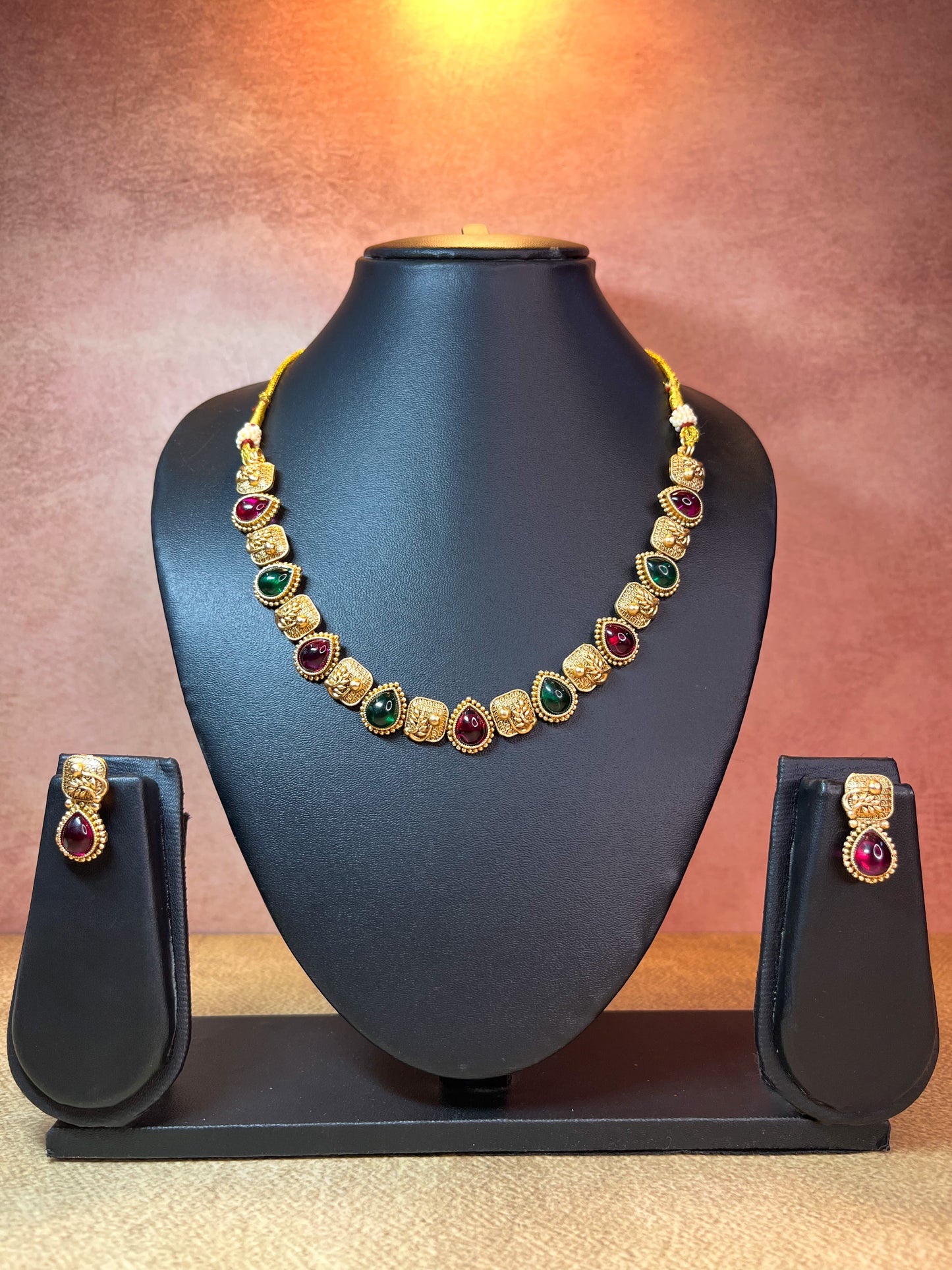 Red and Green stone gold set
