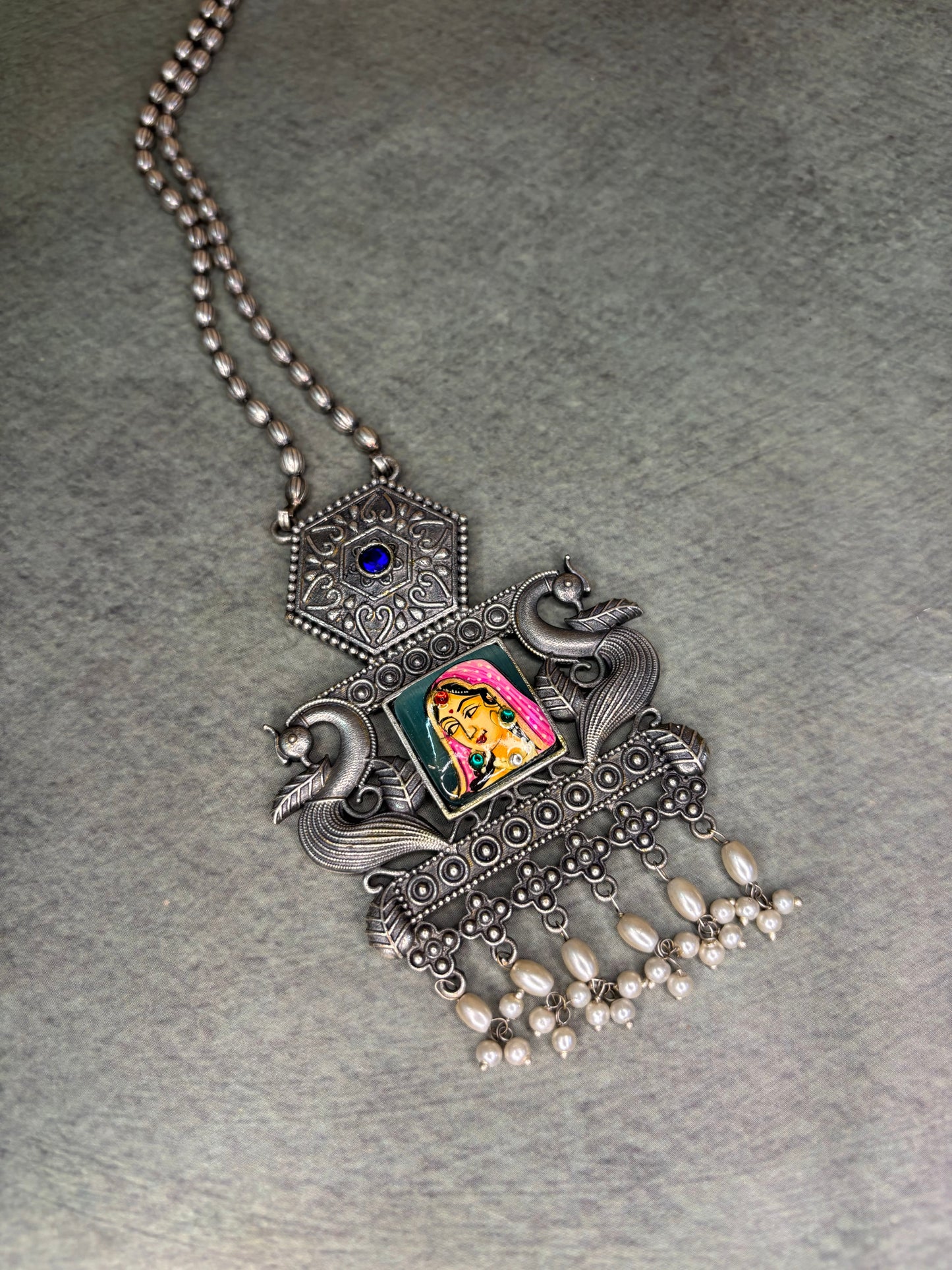 Rajasthani-inspired silver replica set with queen motif