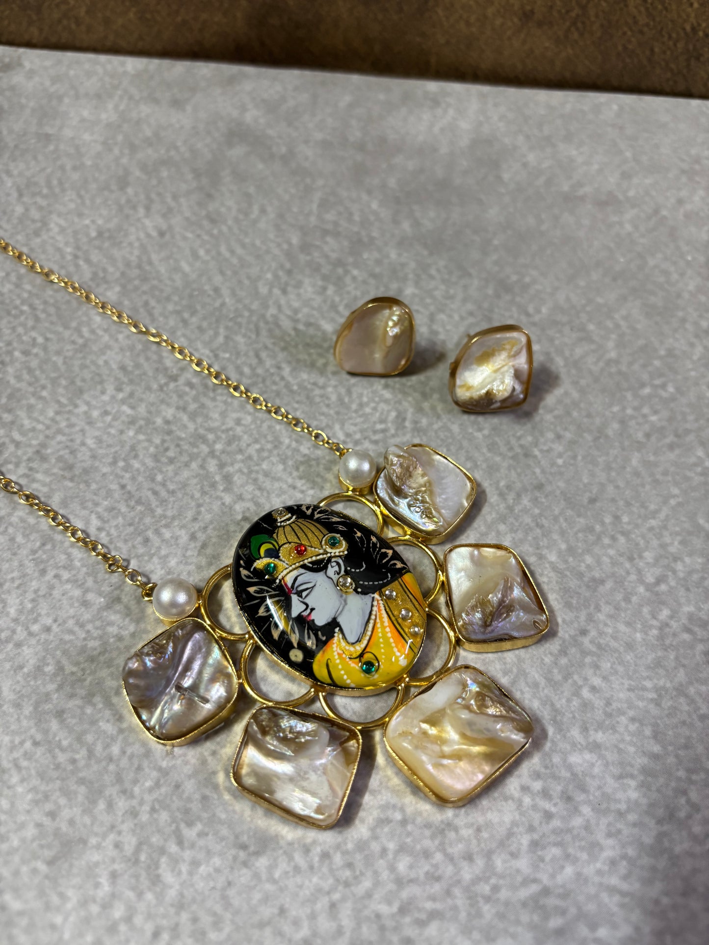 Gold-Tone Krishna Motif Necklace with Mother of Pearl Stones & uncut stone studs