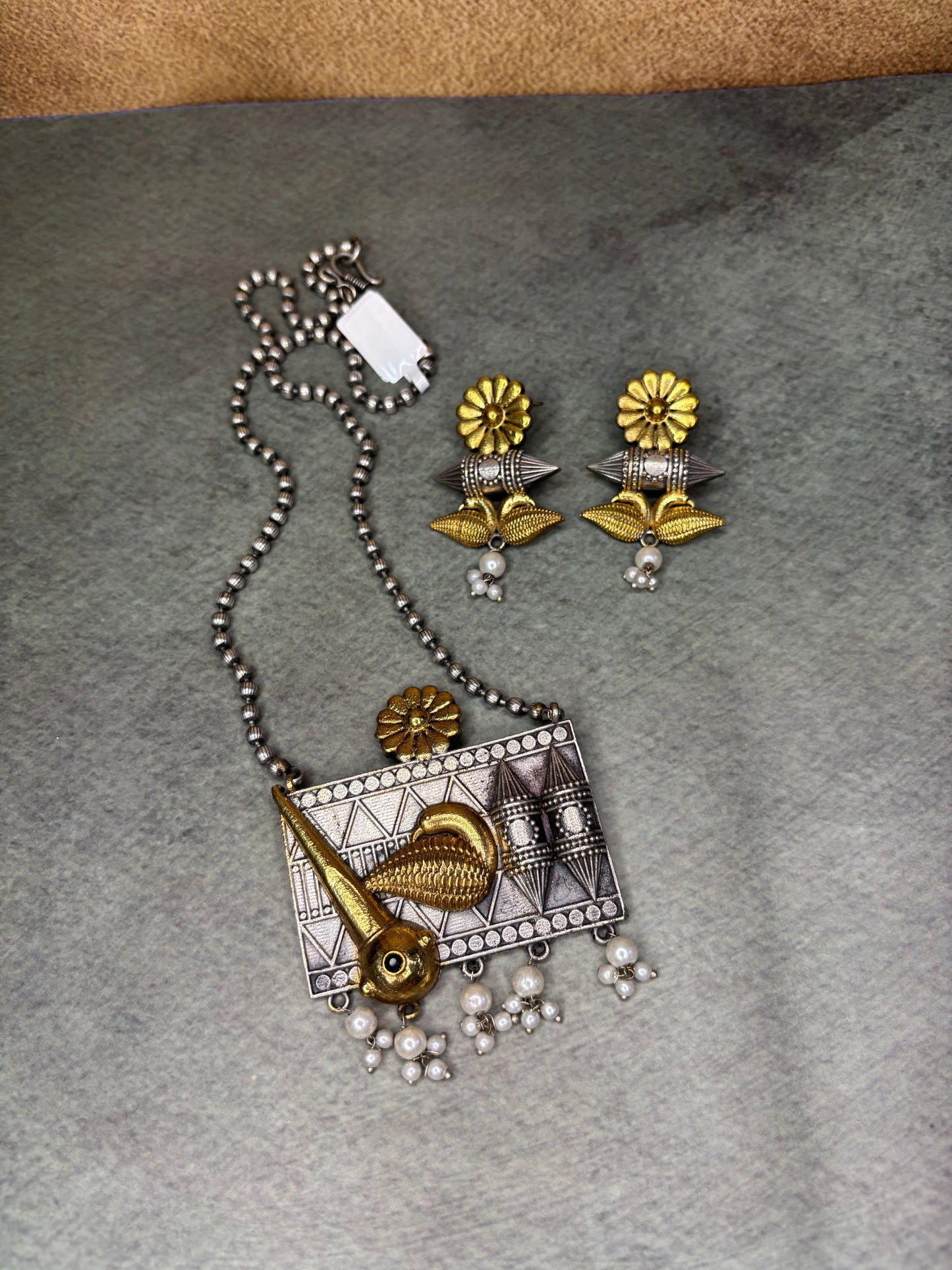 Handcrafted Tribal Pendant with Golden Bird Motif Pearl Drops