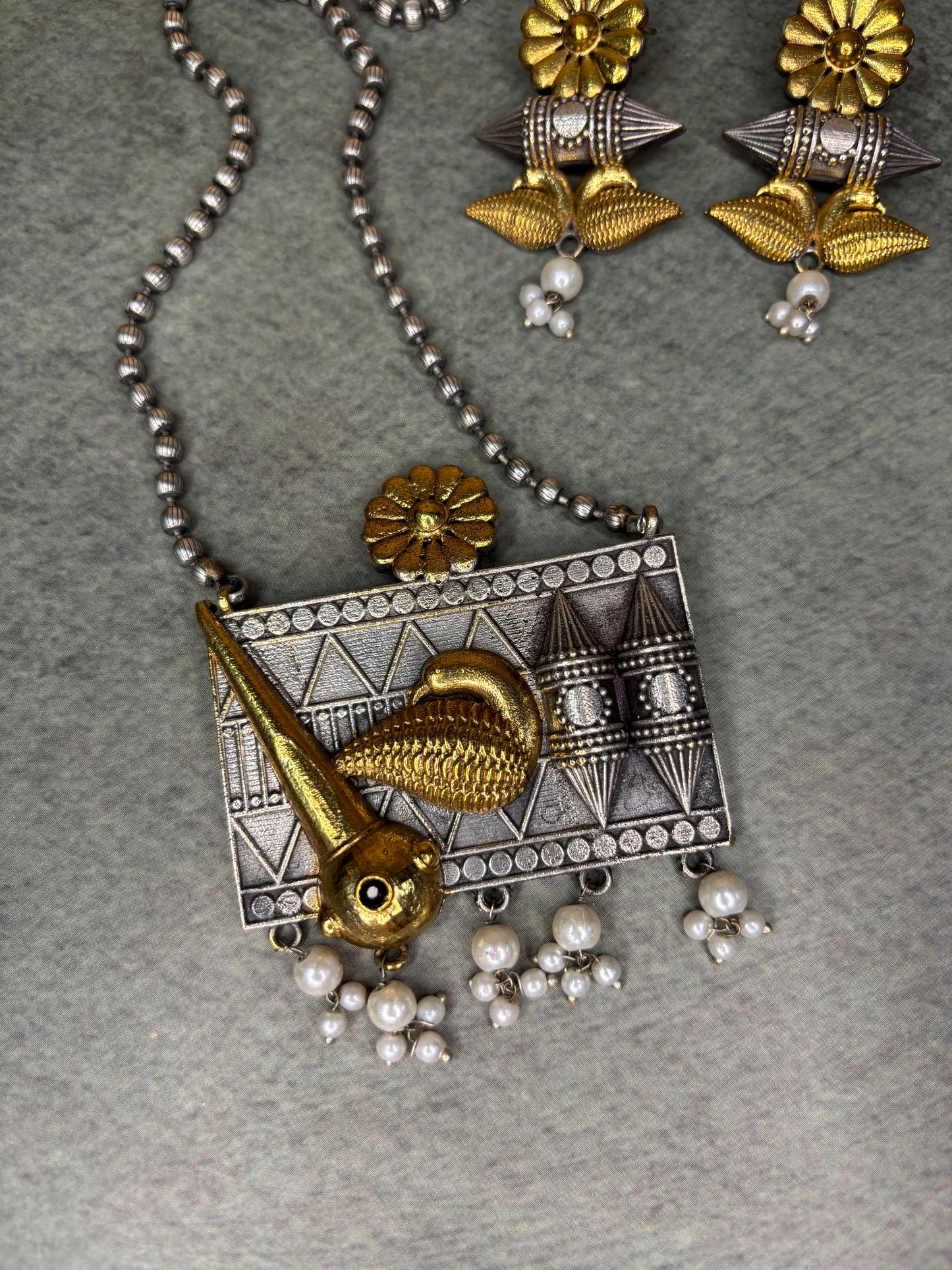 Handcrafted Tribal Pendant with Golden Bird Motif Pearl Drops