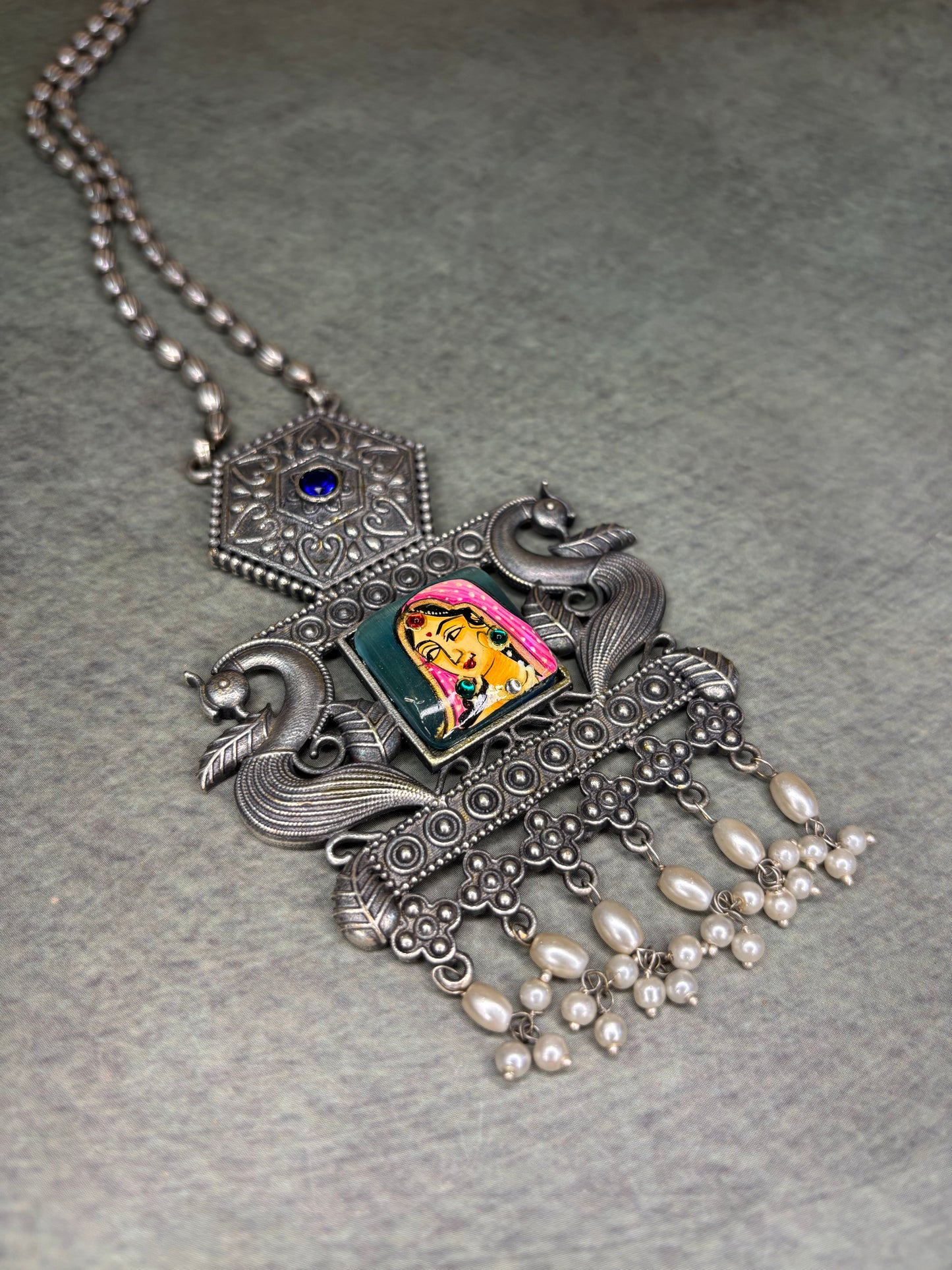 Rajasthani-inspired silver replica set with queen motif