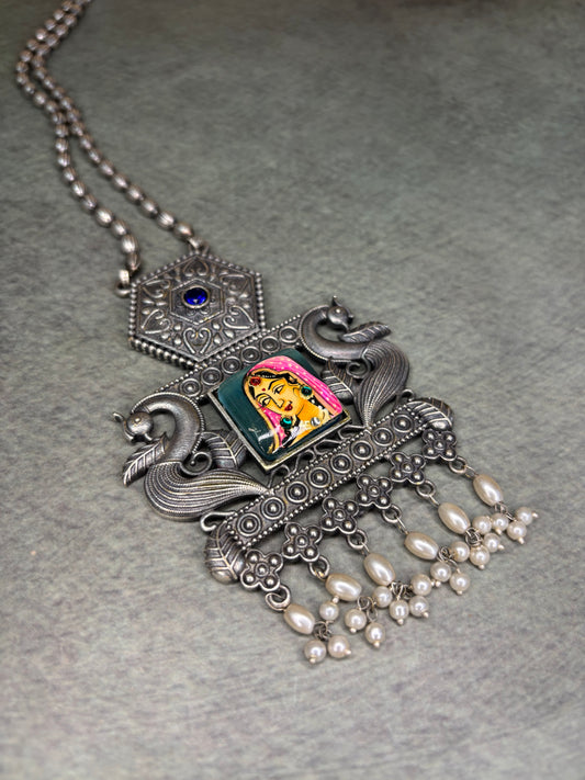 Rajasthani-inspired silver replica set with queen motif