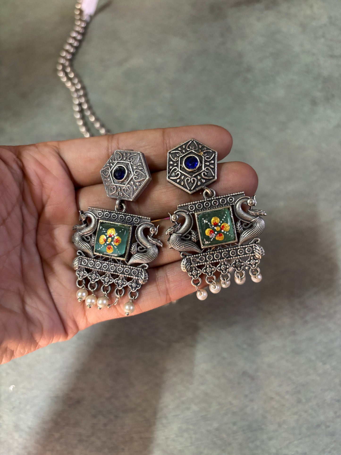 Rajasthani-inspired silver replica set with queen motif