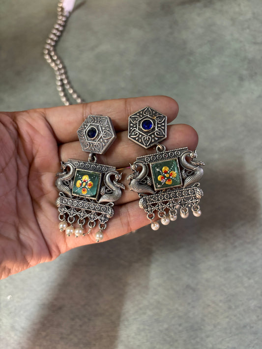 Rajasthani-inspired silver replica set with queen motif